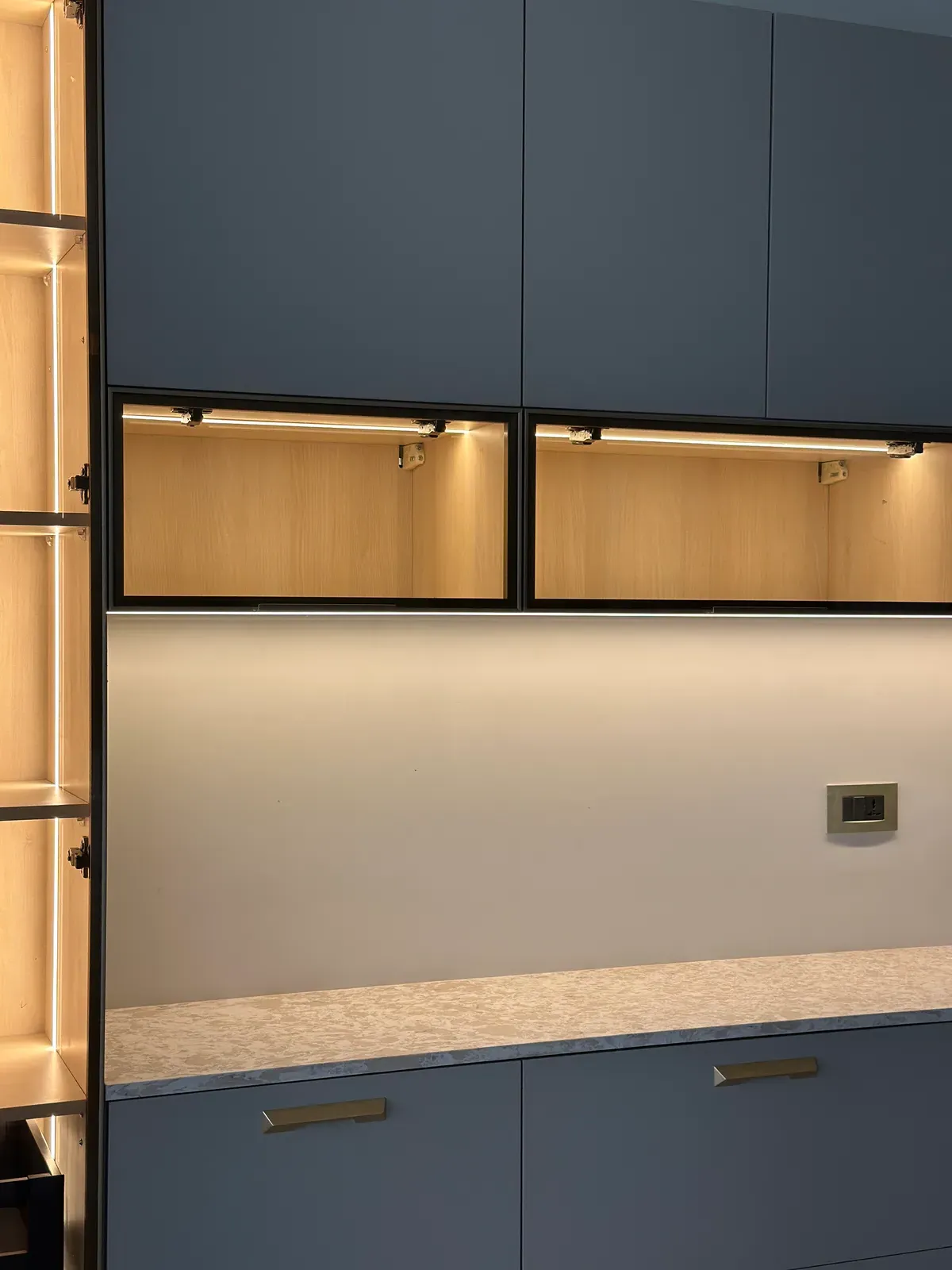 Crockery unit with lit open shelf and grey cabinets — Seema Katta Crockery
